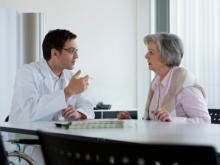 doctor consulting with mature woman patient.jpg